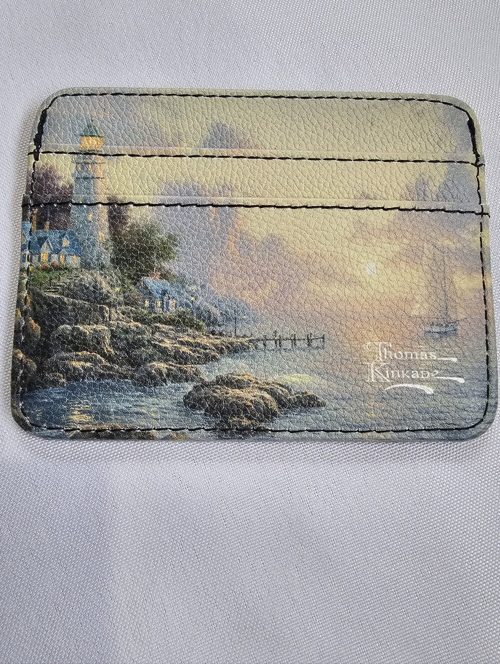 Thomas Kinkade Coastal Lighthouse Card Sleeve in Pastel Blues and Golds